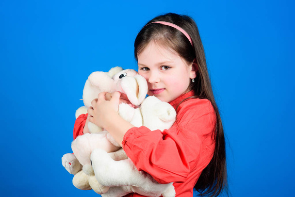 Collecting toys hobby. Cherishing memories of childhood. Small girl smiling face with toys. Happy childhood. Little girl play with soft toy teddy bear. Lot of toys in her hands. Childhood concept - Foto, immagini