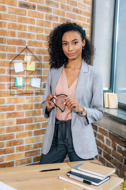 beautiful african american Casual businesswoman with glasses in loft office - Photo, image