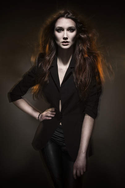 Photo of beautiful young woman fashion model with magnificent hair and red lips - Fotó, kép