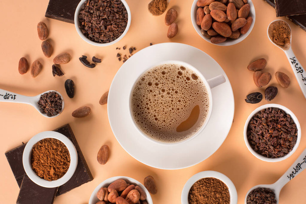 Natural cocoa beans and hot chocolate - Photo, Image