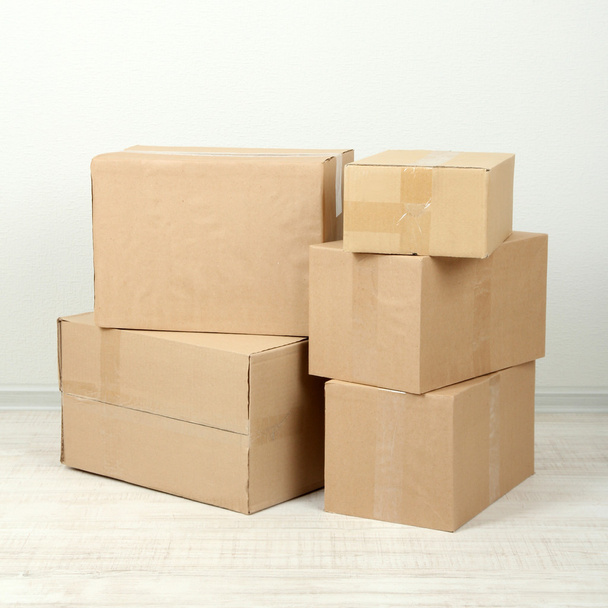 Different cardboard boxes in room - Photo, image