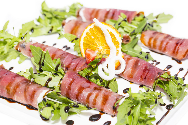Rolls of meat and greens on a white background in the restaurant - Фото, зображення