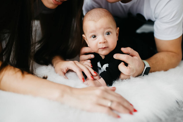 Portrait of a happy family with a little baby boy.  - Fotó, kép