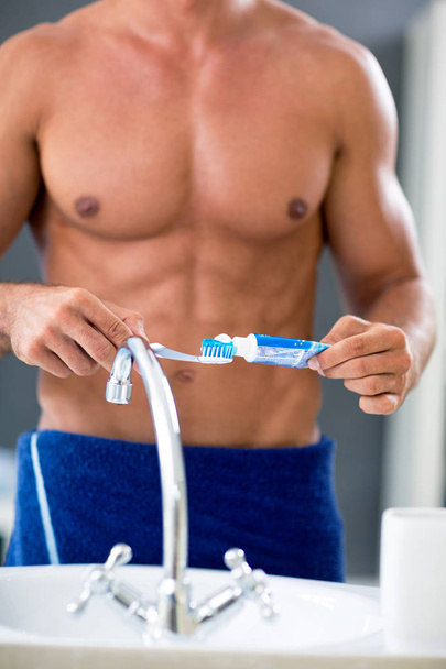Male naked torso of male with toothpaste and brush  - Zdjęcie, obraz