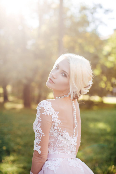 Beautiful Young Bride  in White Wedding Dress Posing in Park - Photo, Image