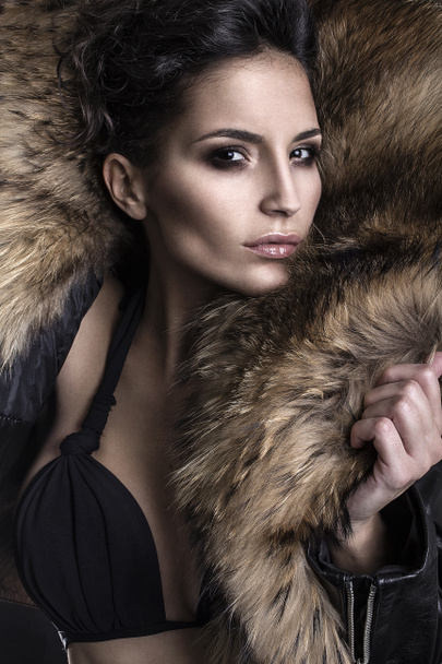Portrait of a young fashion model wearing fox fur smoky eyes - Foto, Imagem
