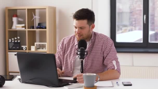 happy young man with laptop and microphone at home - Πλάνα, βίντεο