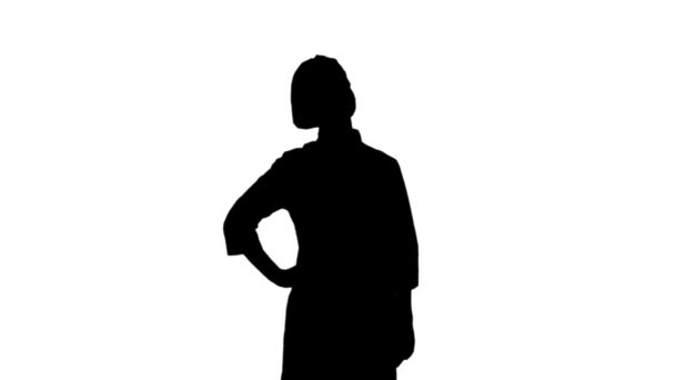 Black silhouette of a cook female gesticulating recommending her restaurant. - Filmagem, Vídeo