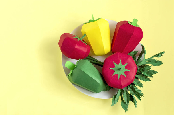 Paper tomatoes, peppers and parsley on paper plate - Photo, Image