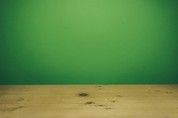 Beautiful white wooden table and green wall background. - 写真・画像