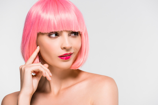 pensive naked girl in pink wig isolated on grey - 写真・画像
