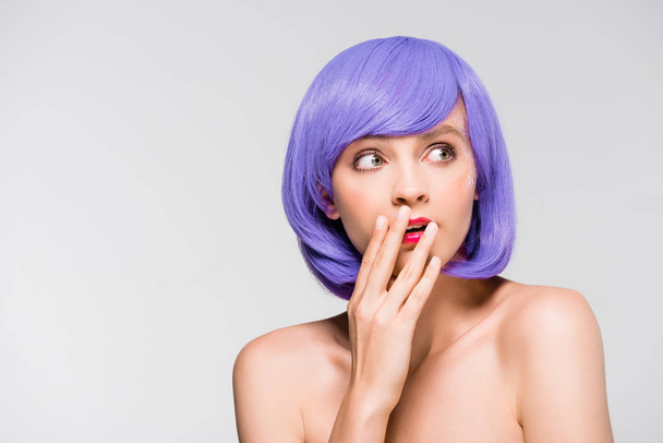 surprised beautiful naked girl in purple wig isolated on grey - 写真・画像