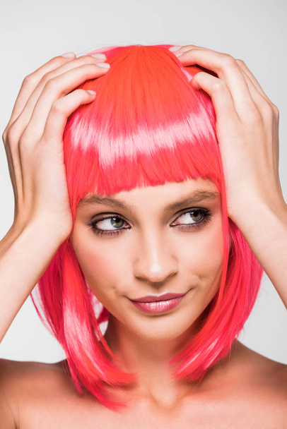 attractive young woman in pink wig isolated on grey - Photo, Image