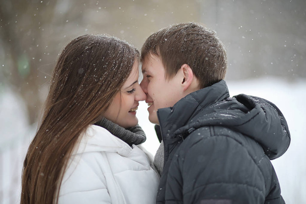 pair of lovers on a date winter afternoon in a snow blizzard - Photo, Image