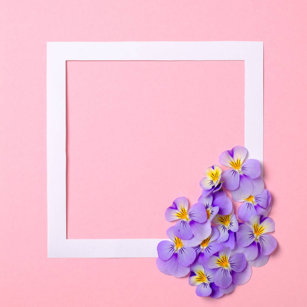 Flat lay frame with flower petals on watercolor spring background. Top view, floral frame, abstract design. Invitation, greeting card or an element for your design. - Fotó, kép