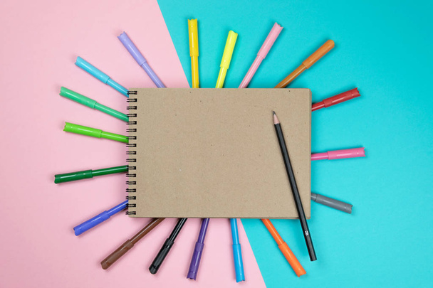 School notebook and various stationery. Back to school concept. Multicolored background.  - Фото, зображення