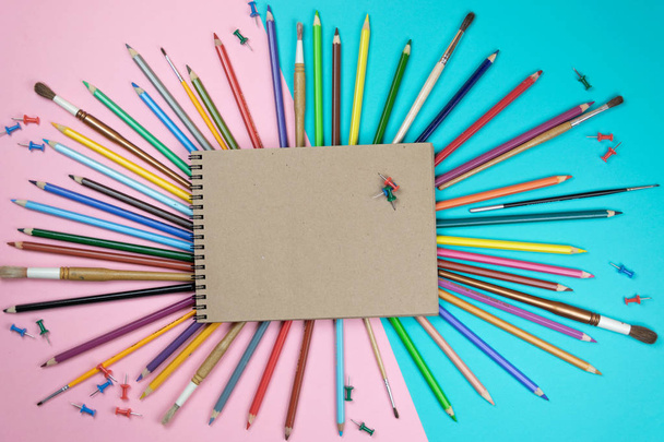 School notebook and various stationery. Back to school concept. Multicolored background.  - Valokuva, kuva