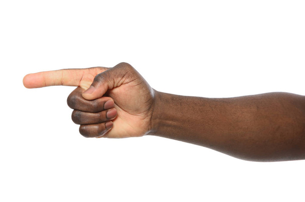 African-American man pointing at something on white background, closeup - Zdjęcie, obraz