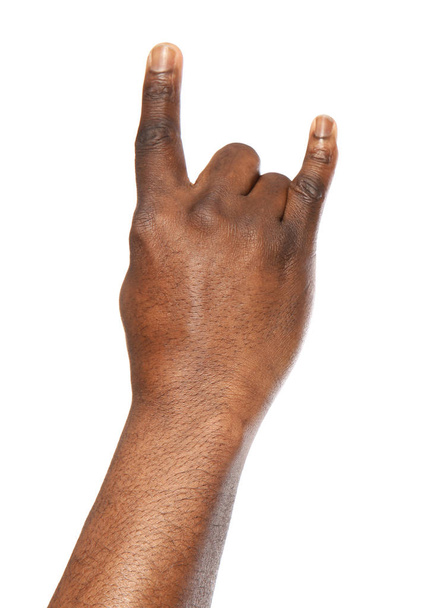 African-American man showing ROCK gesture on white background, closeup - Foto, afbeelding
