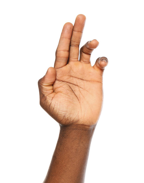 African-American man showing hand gesture on white background, closeup - Fotoğraf, Görsel