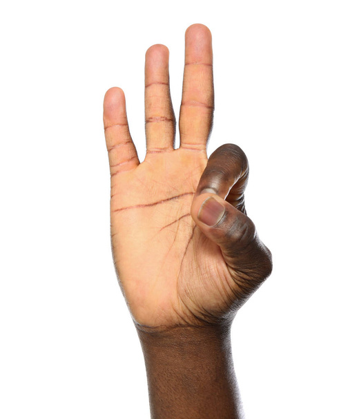 African-American man showing OK gesture on white background, closeup - Foto, Imagem