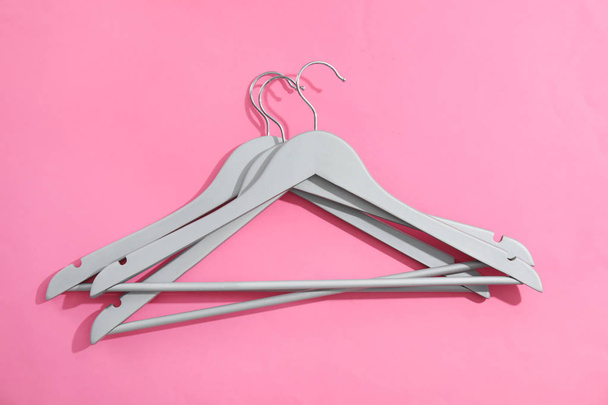 Flat lay composition with empty hangers on color background - Photo, Image