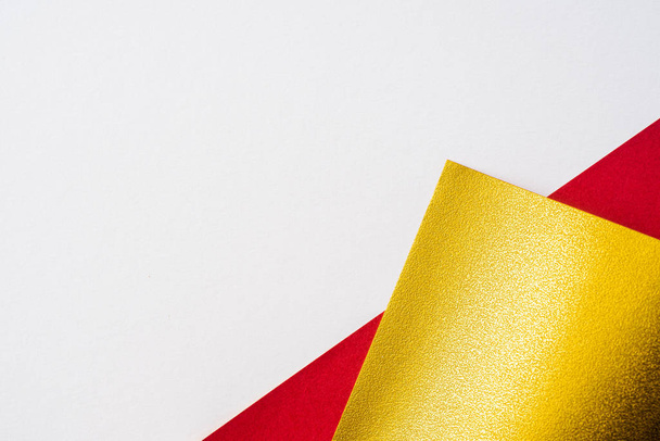 Red and golden paper on white background - Foto, imagen
