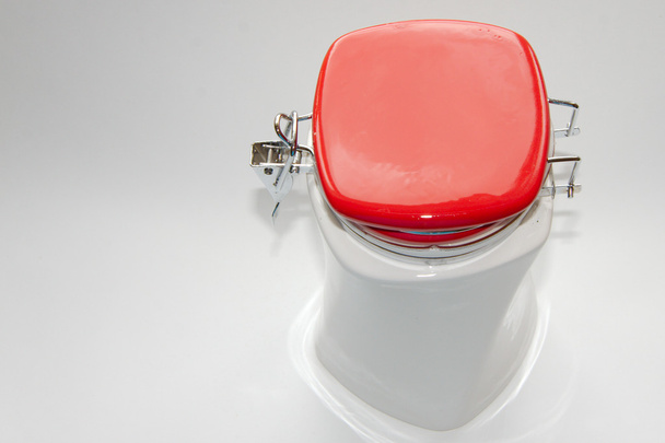 White jar with red lid - Foto, imagen