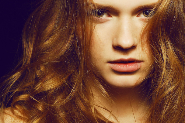 Emotive portrait of a young beautiful girl with long ginger (red - Photo, image