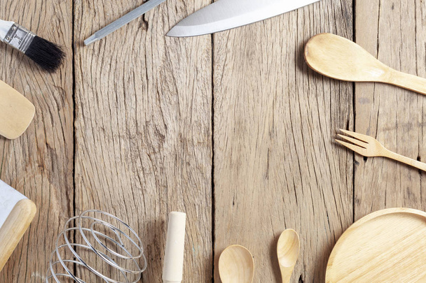 Set of wooden spoon,fork,knife, on old wooden table background - Foto, imagen