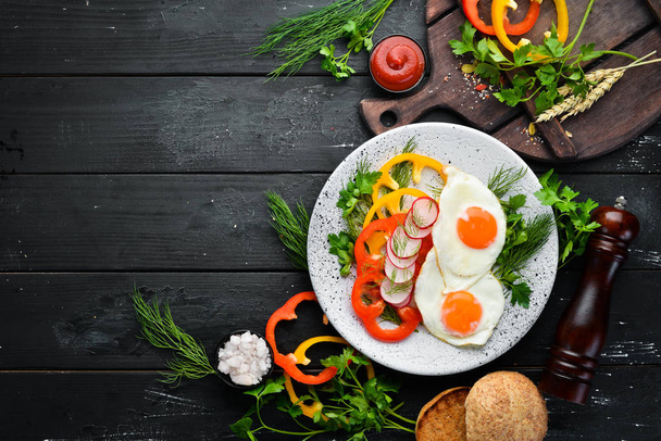 Breakfast. Fried eggs with vegetables. Top view. Free copy space. - Foto, imagen