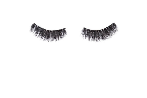 Pair of long false lashes over the white background. Style, trend, fashion concept - Photo, Image