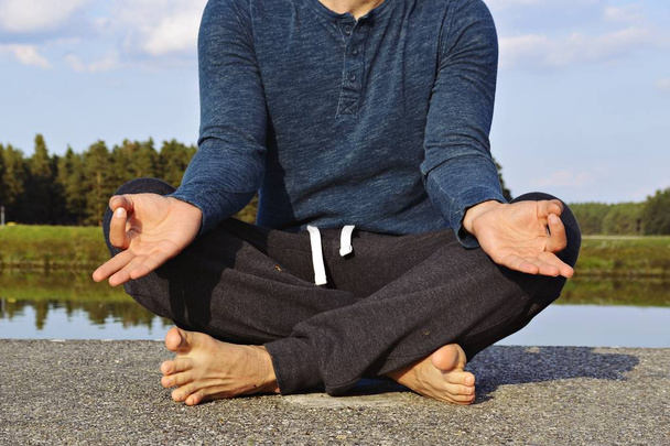 Meditating man close up  - Фото, изображение