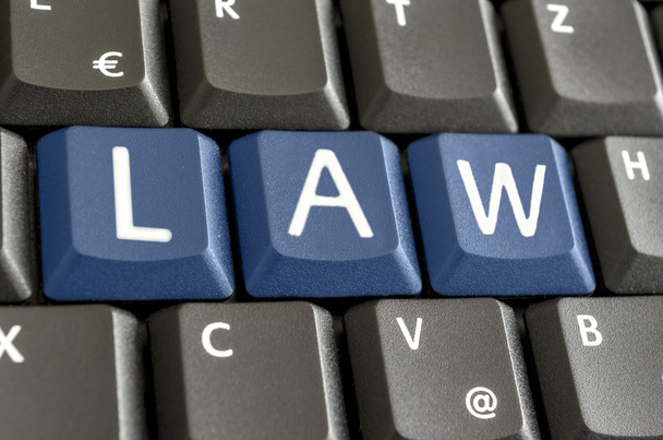 λέξη νόμος γράψει στο πληκτρολόγιο του υπολογιστή - Φωτογραφία, εικόνα