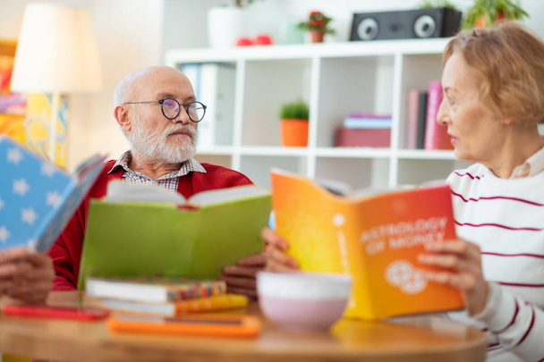Pleasant senior people enjoying reading different books - Φωτογραφία, εικόνα