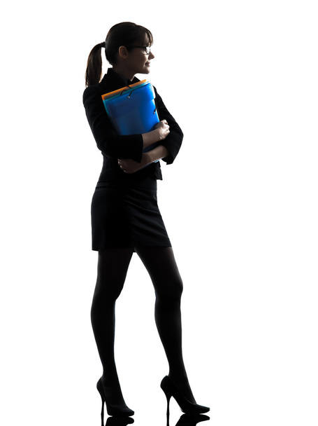 business woman holding folders files standing silhouette - Foto, afbeelding