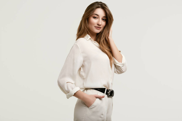 Gorgeous female brunette model in white clothes - Valokuva, kuva