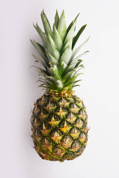 Whole pineapple isolated on white - Фото, изображение