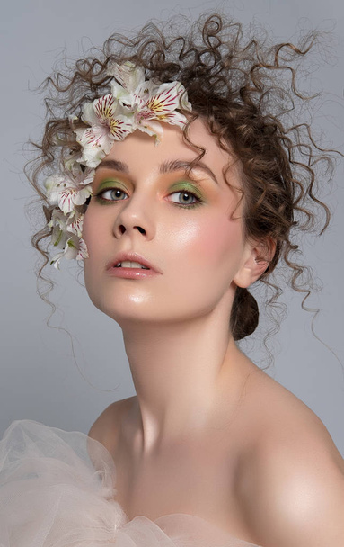 Fashion portrait of a  young woman with a bright eye creative ma - Fotó, kép