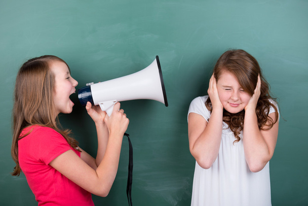 Young schoolgirl making herself loudly heard - Zdjęcie, obraz