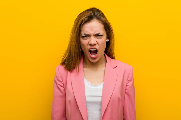 Young fashion business woman screaming very angry and aggressive. - Zdjęcie, obraz