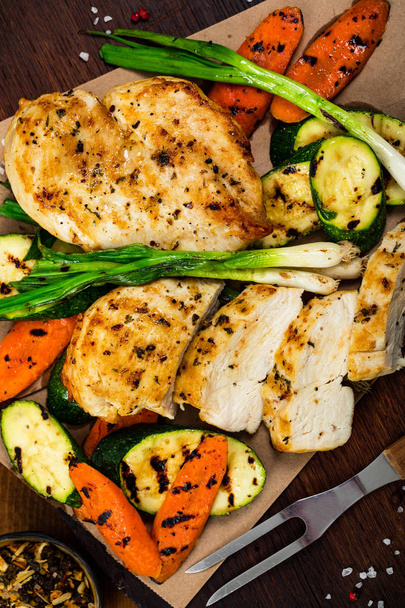 Grilled Chicken Breasts with Grilled Vegetables Zucchini and Carrot. Selective focus. - Photo, Image