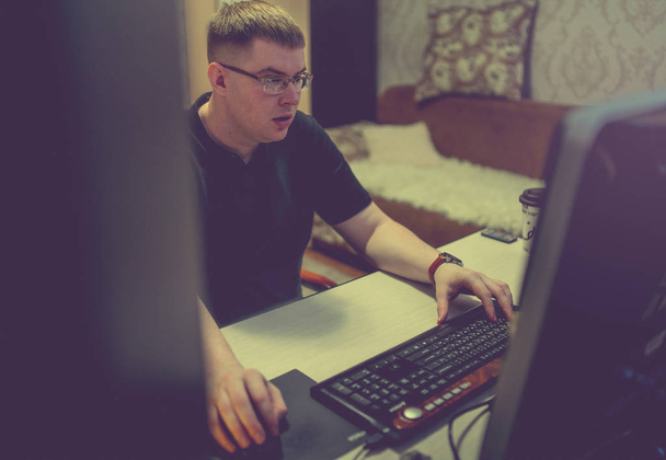 young man  at the computer, work on a laptop - Photo, Image