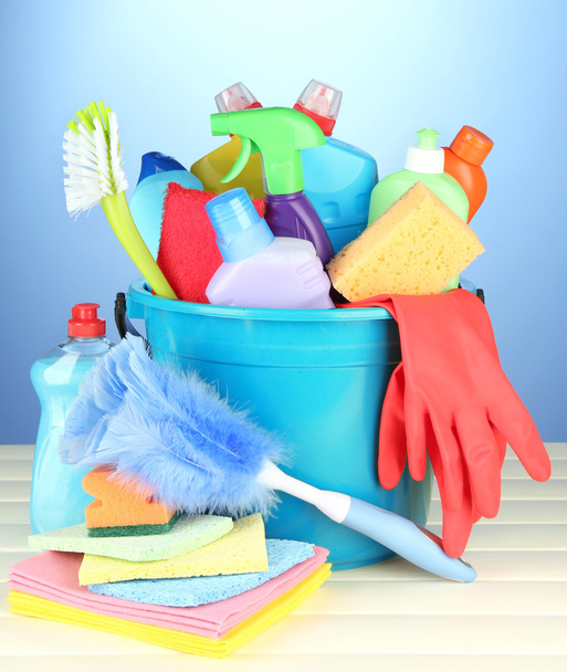 Cleaning items in bucket on color background - Photo, image