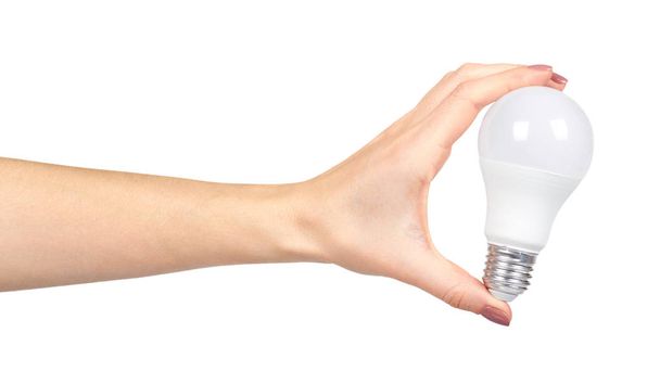 Hand with white LED bulb, eco friendly lamp, modern equipment. - Valokuva, kuva