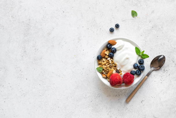 Granola with yogurt and berries - Фото, изображение