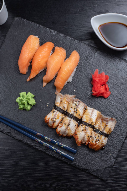 Sushi Set sashimi and sushi rolls served - Foto, Bild