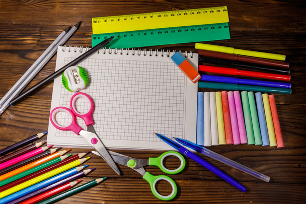 Set of school stationery supplies on wooden desk. Back to school - Fotó, kép