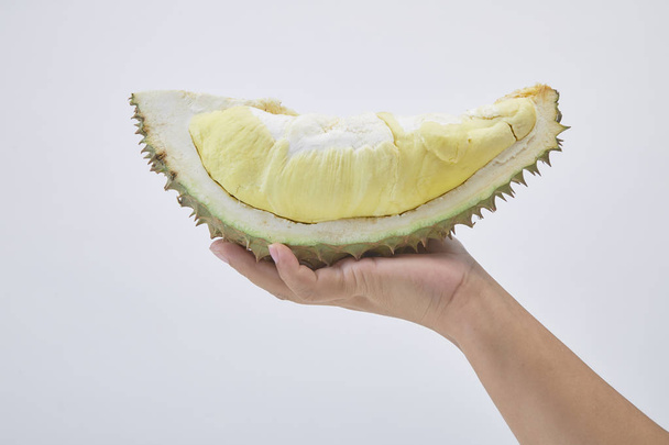 Hand holding fresh cut Durian - Valokuva, kuva
