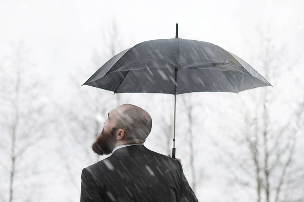 A bald bearded man in a suit - Фото, изображение